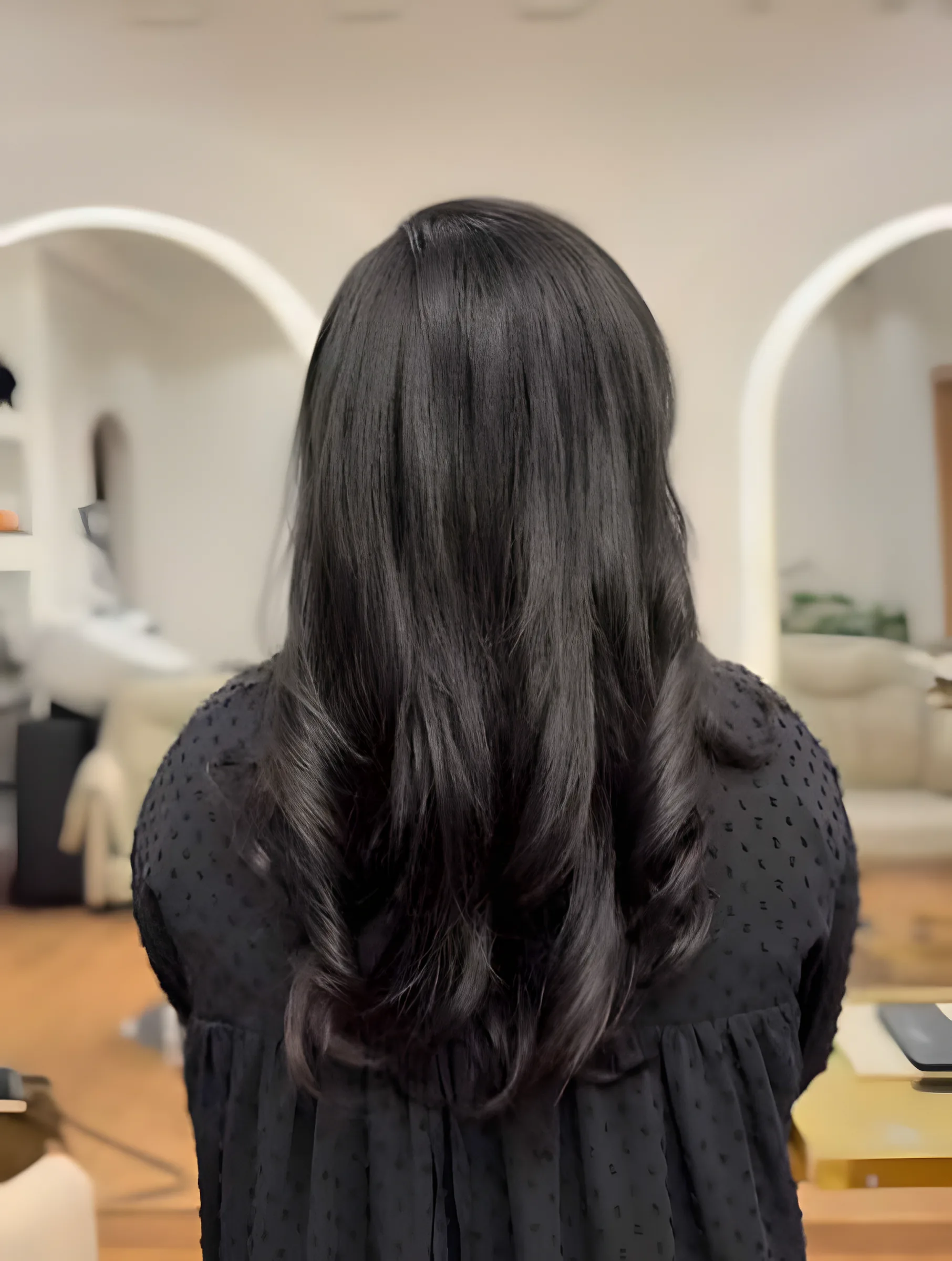KTip extensions from behind, in the studio's white arches